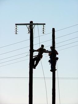 Two workers on two pylons - let's connect!